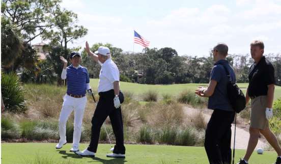 FILE PHOTO:Japanese PM Abe and U.S. President Trump are seen at Trump International Golf club in West Palm Beach, Florida